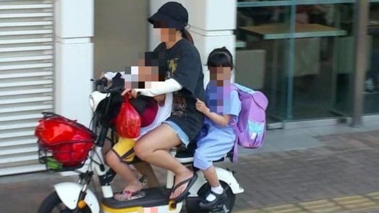 女子上水駕電動單車載兩小童 涉無牌駕駛被捕