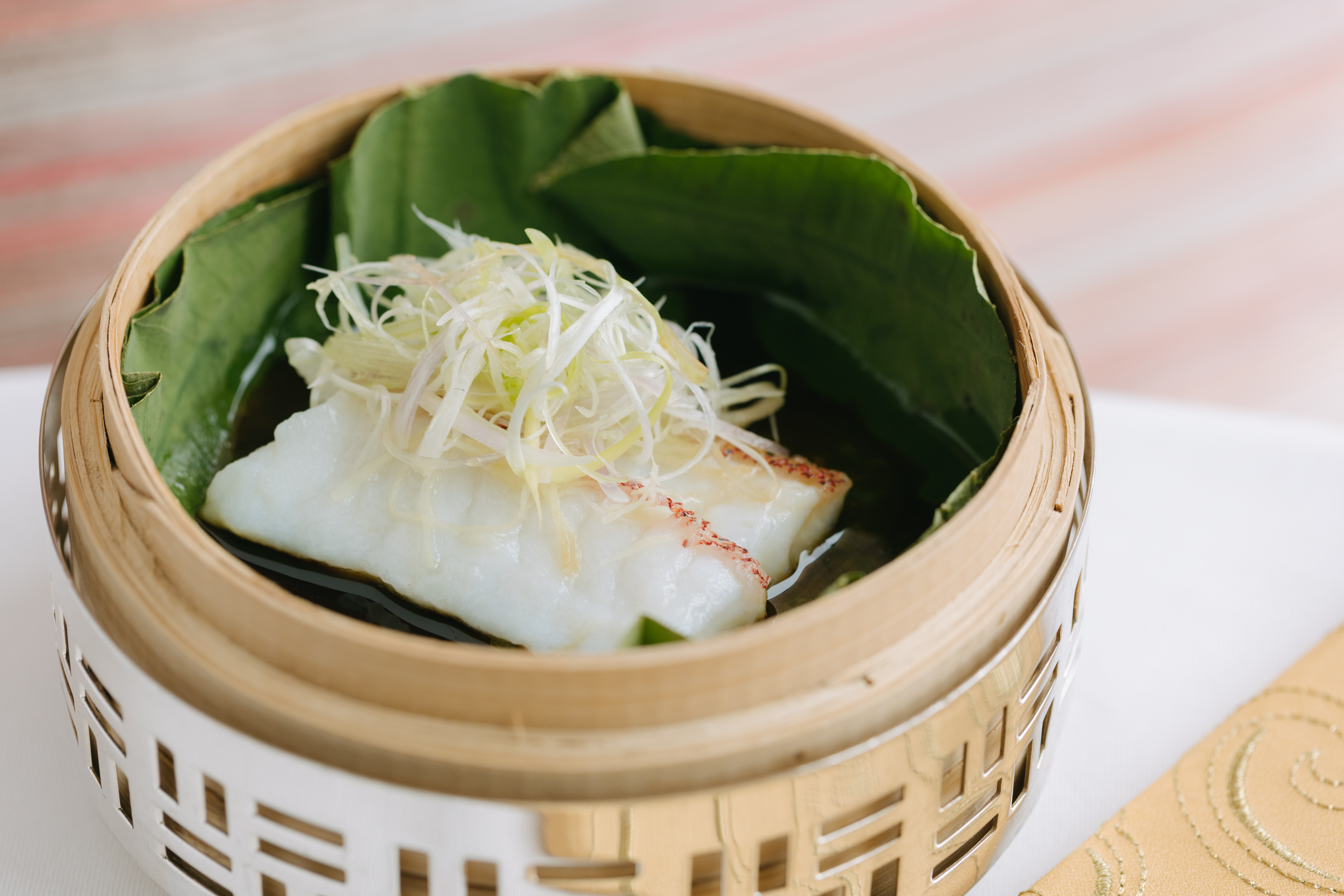 Lung King Heen_Steamed Star Garoupa Fillet with Ginger and Spring Onions in Bamboo Basket 籠仔薑蔥蒸星班柳.jpg